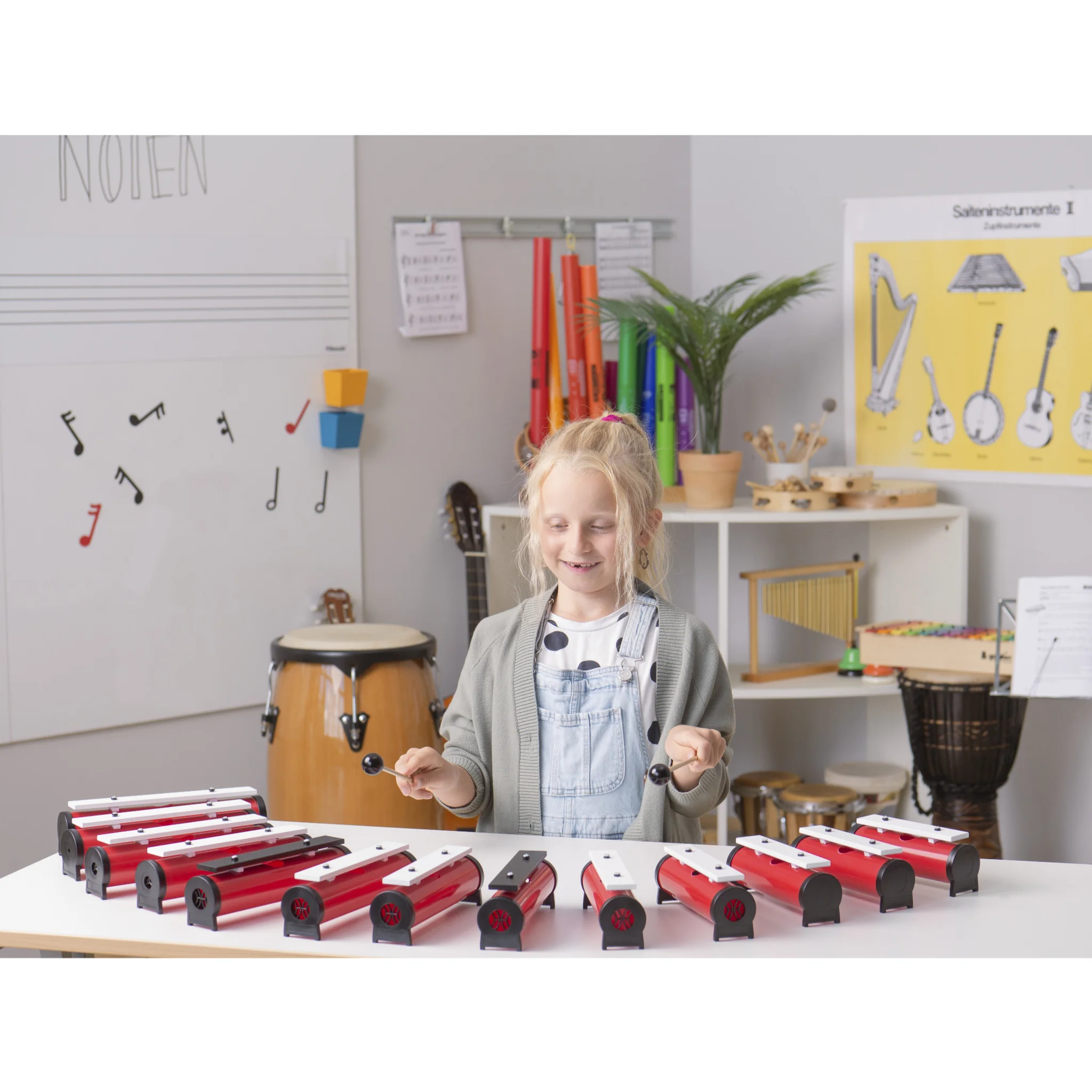 Kinder-Musikinstrumente, Holz-Perkussion, Tastatur-ähnliches Instrument, Rote-weiße Gehäuse, Musikschule Szene