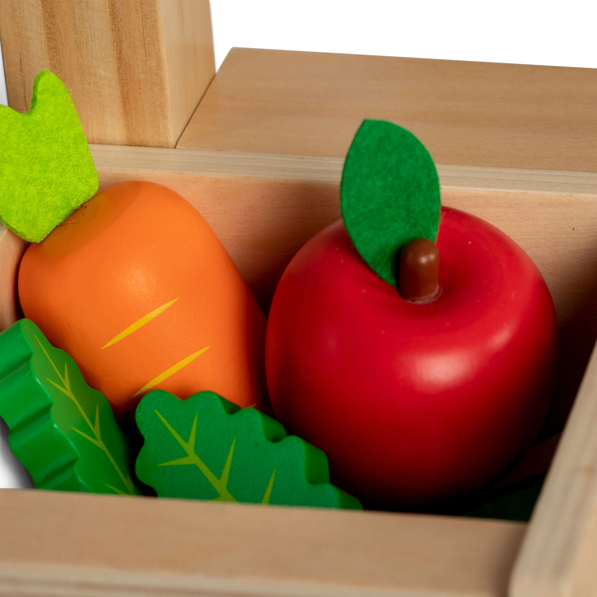 Obstspielzeug, Apfelform, rote Apfel, grüne Blätter, Holzkiste