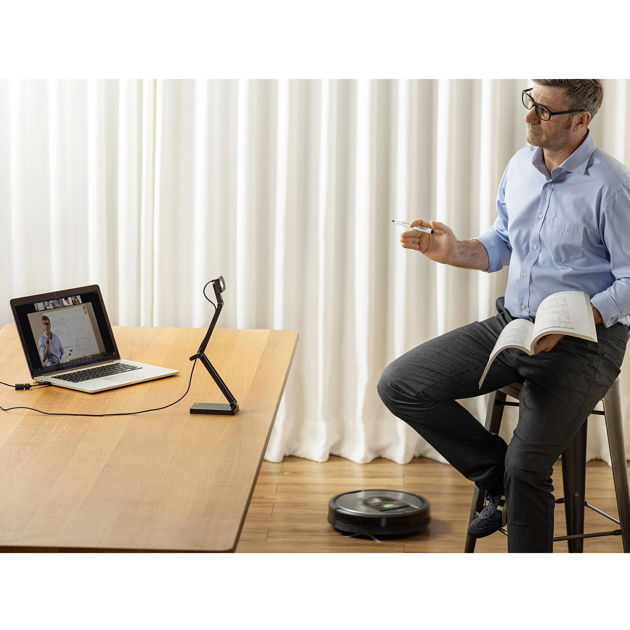 laptop, video call, whiteboard, book, robot vacuum