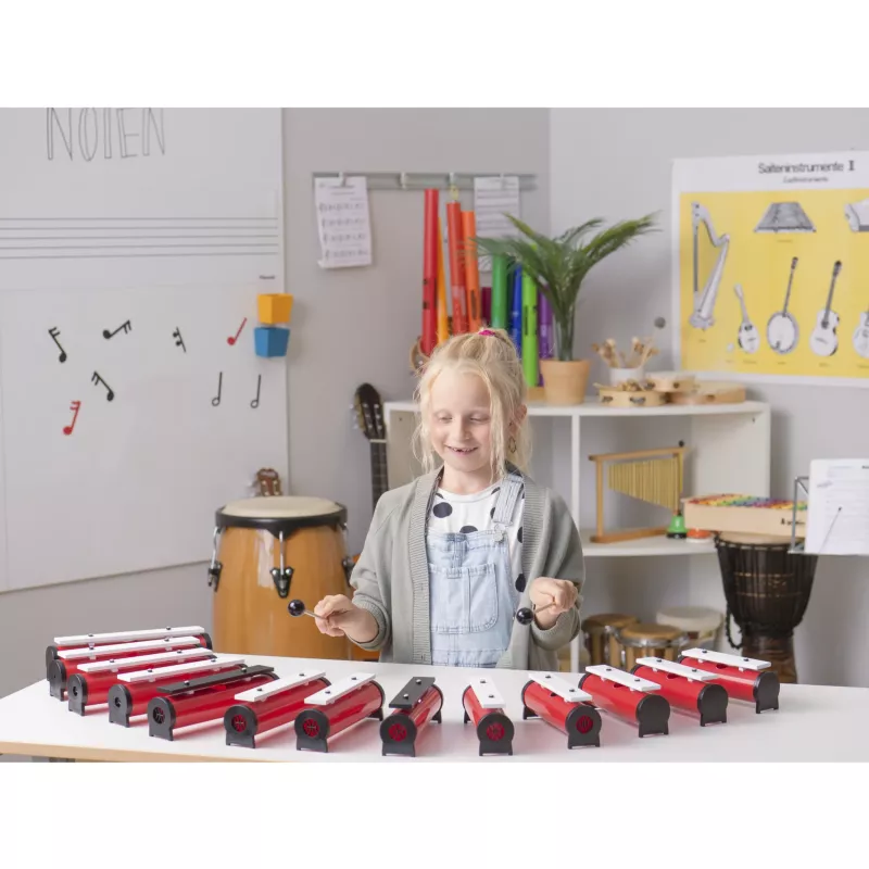 Kinder-Musikinstrumente, Holz-Perkussion, Tastatur-ähnliches Instrument, Rote-weiße Gehäuse, Musikschule Szene