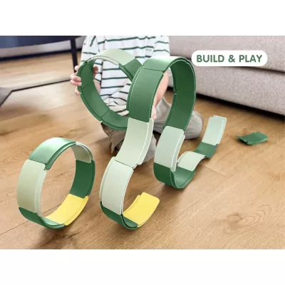 Konstruktionsspielzeug, Ringspielzeug, grüne Ringe, ineinandergreifende Ringe, modulares Spielzeug