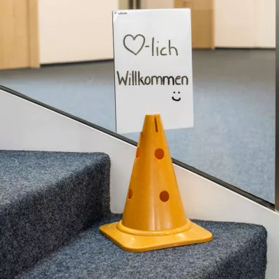 orange cone, traffic cone, cone, floor marker, stair area sign