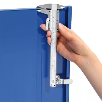 digital_caliper, measuring_scale, machining, blue_cabinet, hand_measurement