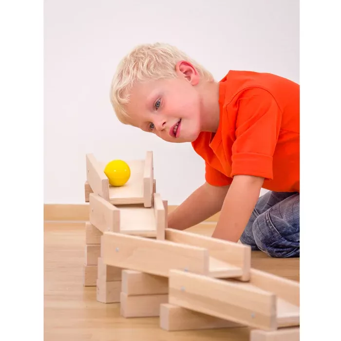 kindergarten toy, wooden blocks, construction toy, ball, orange shirt